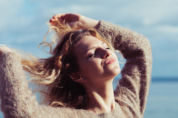 Happy woman outdoor wearing jumper