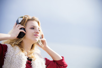 Woman wearing headphones outdoor