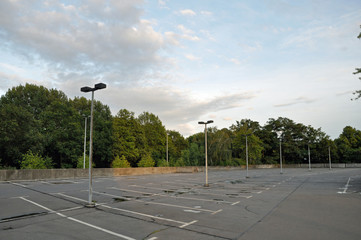 Empty parking ground with lamps