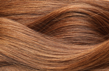 Texture of healthy red hair as background, closeup