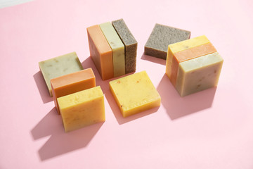 Hand made soap bars on color background
