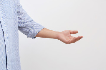 Man giving helping hand on light background