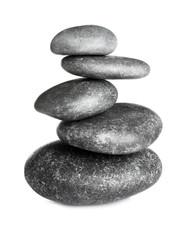 Stack of zen spa stones on white background
