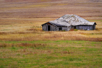 A crumbling farm building out on the Canadian praries.