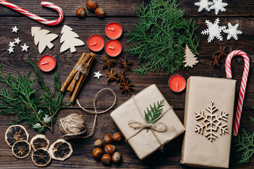 Christmas, New Year, DIY, holidays preparation and creativity concept. Festive decorations and gift boxes flat lay. Atmospheric festive mess