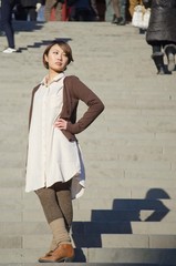 Japanese Girl poses on the street in Kamakura, Japan. Kamakura is an area located in Kanagawa where is a bit south of Tokyo.