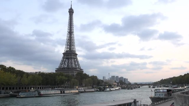 Time lapse of Eiffel Tower By River at sunset  with zoom