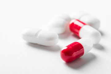Pharmacy theme, white and red medicine tablets antibiotic pills.