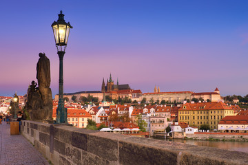 Charles Bridge in the morning with old Prague and St. Vitus cathedral