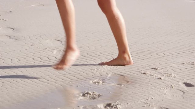 Young Woman Dancing And Turning Cartwheel On Summer Beach Vacation