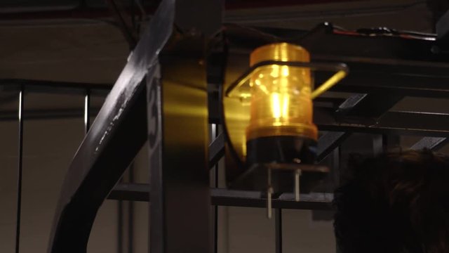 Close Up of Gears and Chains of Fork Lift Moving Upward