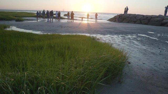 Panning shot of beach at sunset in Cape Cod, Massachusetts