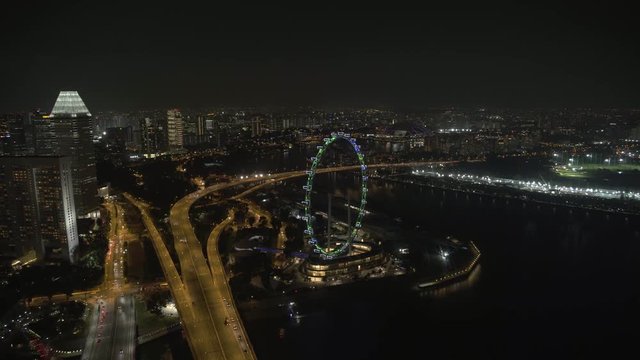 Footage from the Skypark atop Marina Bay Sands Hotel in Singapore. The footage looks North East Towards the Singapore Flyer and OCBC Aqautic Center
