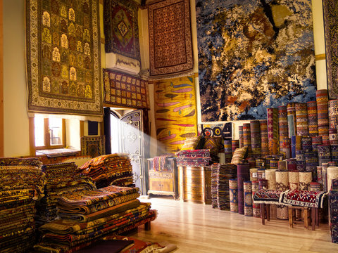 Hand made carpet store interior and light beam in Antalya, Turkey