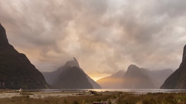 Beautiful evening sunset cloud at Milford Sound, a fjord within Fiordland National Park, Piopiotahi (Milford Sound) Marine Reserve, and the Te Wahipounamu World Heritage site, New Zealand.(Time lapse)