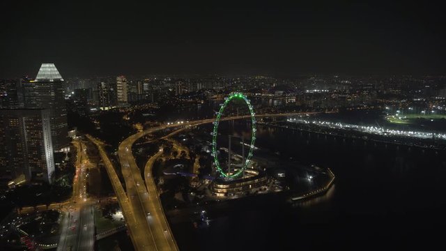 Timelapse footage from the Skypark atop Marina Bay Sands Hotel in Singapore. The footage looks North East Towards the Singapore Flyer and OCBC Aqautic Center