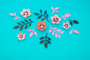 Flower and leaves of paper turquoise background