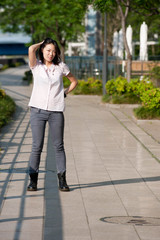 Japanese Girl poses on the street in Yokohama, Japan. Yokohama is a port city located in a bit south of Tokyo.