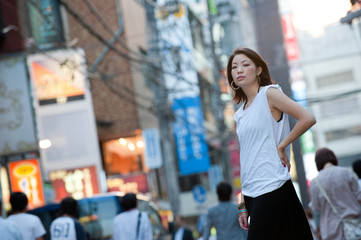 Fototapeta premium Japanese Girl poses on the street in Yokohama, Japan. Yokohama is a port city located in a bit south of Tokyo.