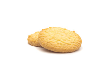 one side of two butter cookies on white background