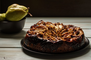 pear cake homemade pastries on a white dish on table.
