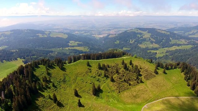 Aerial shot over Alpine landscape, Switzerland in spring
Forest and Alpages