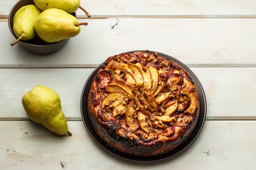 pear cake homemade pastries on a white dish on table.