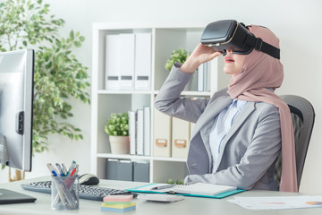 office worker wearing VR technology device
