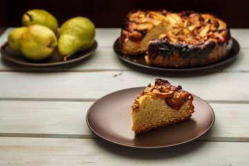 pear cake homemade pastries on a white dish on table.