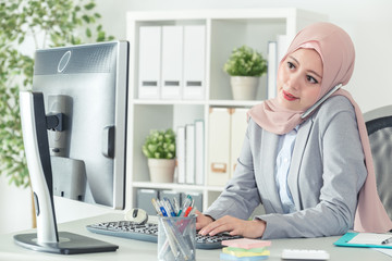 indonesian businesswoman answering phone call