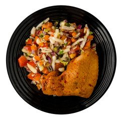 chicken wing with vegetable salad on a plate. chicken wing with vegetable salad isolated on white...