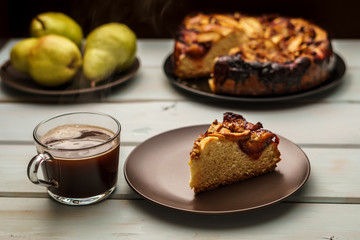 pear cake homemade pastries on a white dish on table.