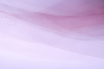 Abstract bright colorful fabric background in the form of a wave