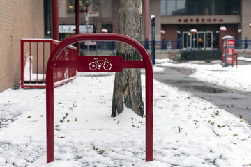 Fototapeta na wymiar Red bicycle rack in city