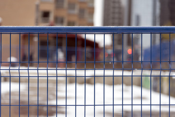Blue metal construction fence
