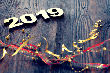  Happy New Year 2019. Symbol from number 2019 on wooden background