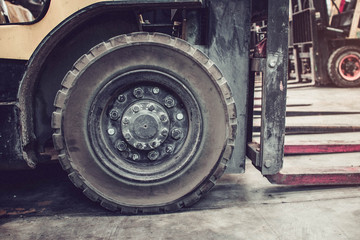 The front wheels of the forklift.