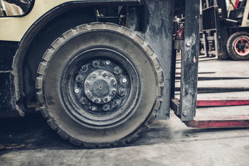 Obraz na płótnie Canvas The front wheels of the forklift.