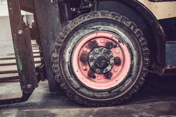 The front wheels of the forklift.