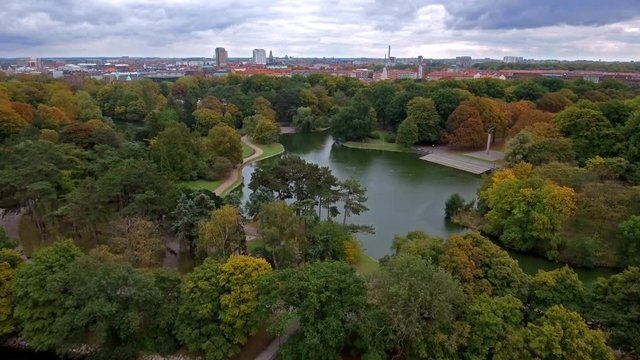 Areal shot of beautiful park and cityscape.