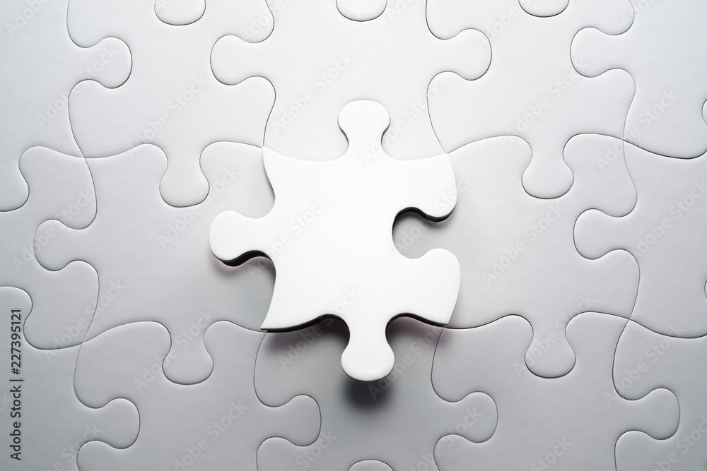 Aufkleber The correct solution. Solving and completing the task.Last piece of jigsaw puzzle. Assembling white jigsaw puzzle pieces.