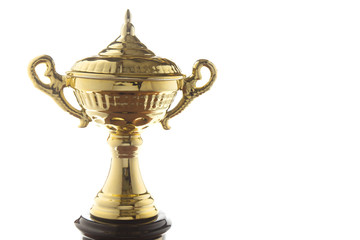 Close up of golden trophy isolated on white background. Winning awards with copy space.
