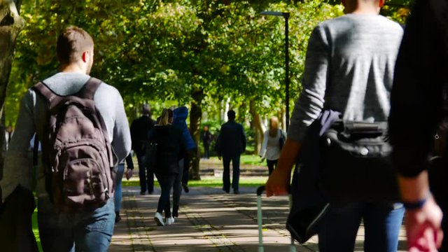 students going to school throught the park in ljubljana