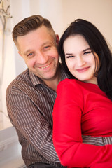 man and woman together on the background of new year lights