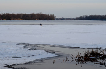 Winter fishing on a frozen river