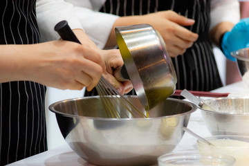 Pastry chef making dough on kitchen, Mixing Buttermilk Pastry Bakery, cookie and cake
