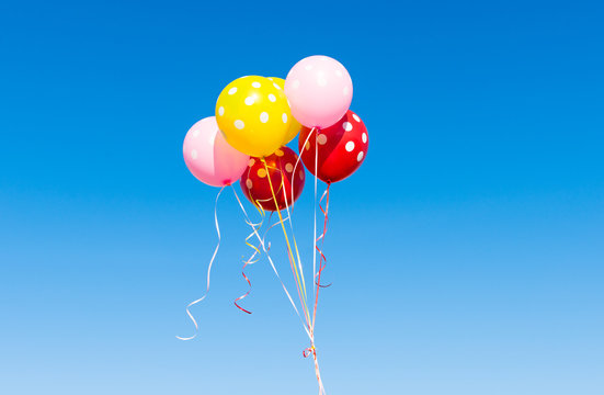 balloons against the blue sky