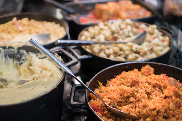 Cuisine Culinary Buffet Dinner Catering Dining Food Celebration Party Concept. Group of people in all you can eat catering buffet food indoor in luxury restaurant with meat and vegetables.