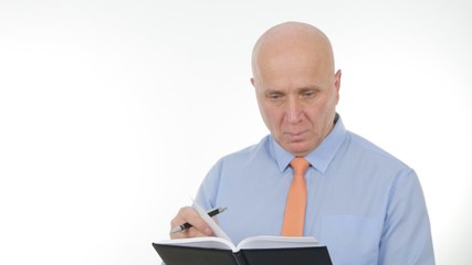 Interior Image with Businessman Writing in Agenda Pages