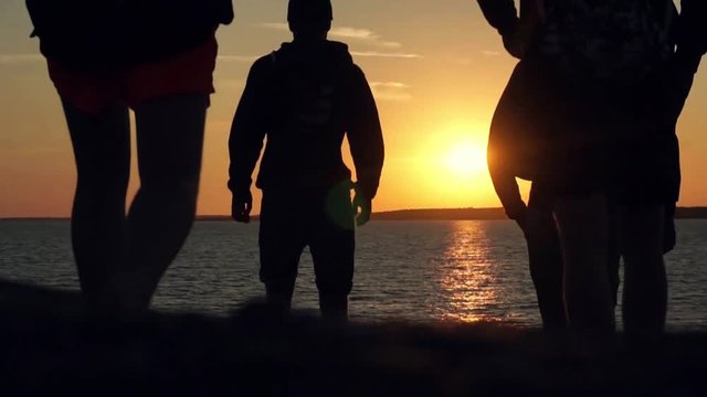 Orange sunset, with people walking by in slowmotion, damn thats smooth